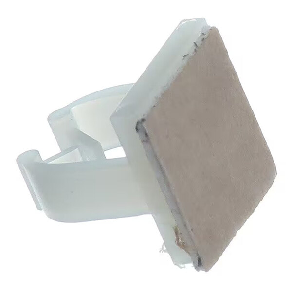 A white plastic clip with a square, flat surface attached to one side.