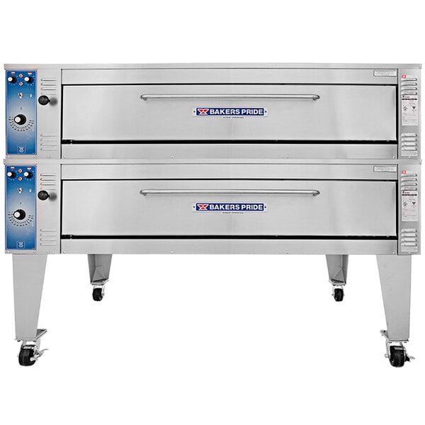 A large silver Bakers Pride double deck electric pizza oven on wheels.