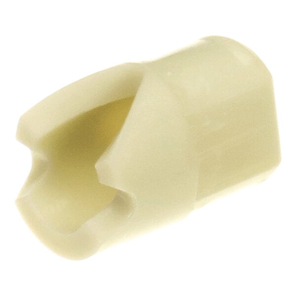 A small, beige, plastic component with a hollow, angled opening and a notched end.