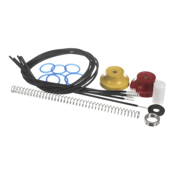 A collection of various small parts including springs, rubber rings, plastic tubes, and colored caps arranged on a white background.