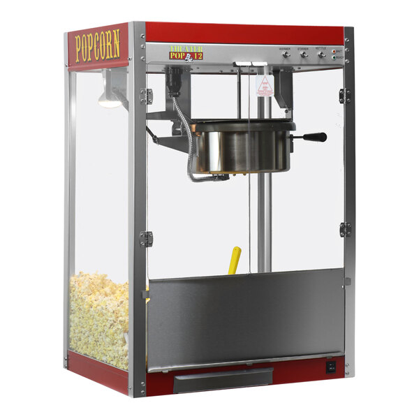 A Paragon commercial popcorn machine with a red and white cover.