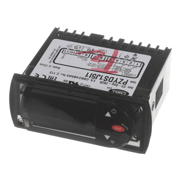 A small black electronic device with a digital display, labeled buttons, and a wiring diagram on top.