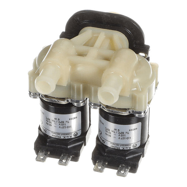 A dual-outlet solenoid valve with two cylindrical black bases, metal terminals, and a beige plastic top housing with two hose connections.