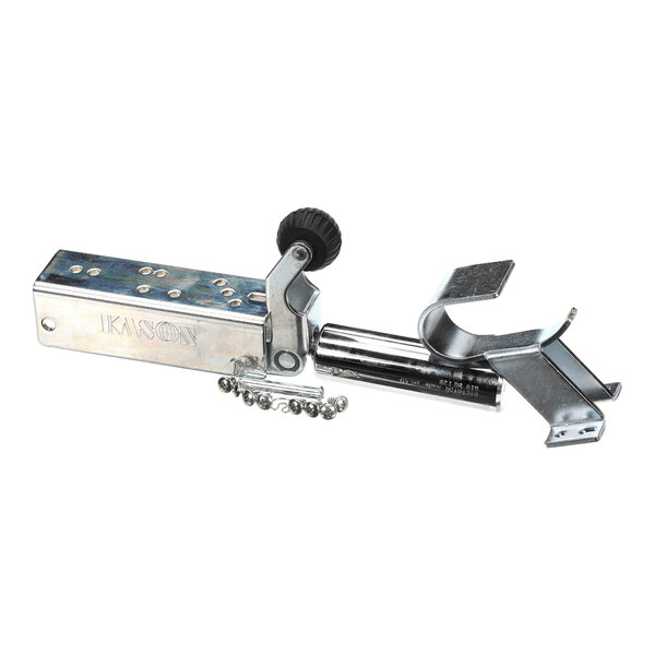 A metallic mechanical device with a rectangular body, a round black knob, a chain, and a clamp-like attachment, photographed on a white background.