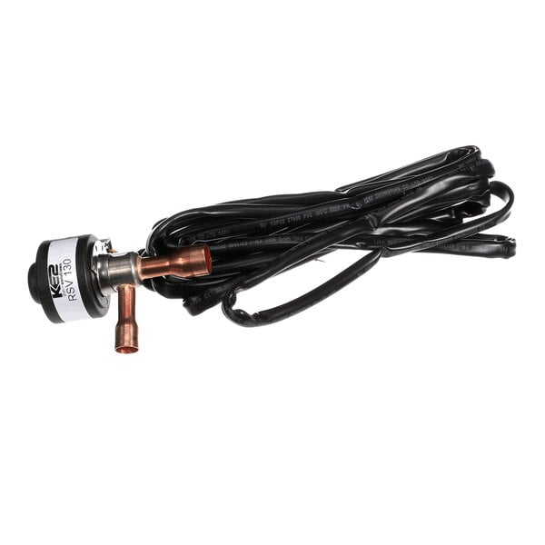 A small electronic valve with copper fittings and a long black electrical cable coiled beside it.