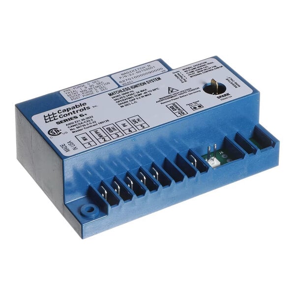 A blue rectangular electronic control module with multiple terminal connectors and a labeled white sticker on top.