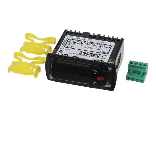 A black electronic control module with a digital display, accompanied by three yellow plastic clips and a green terminal block connector.