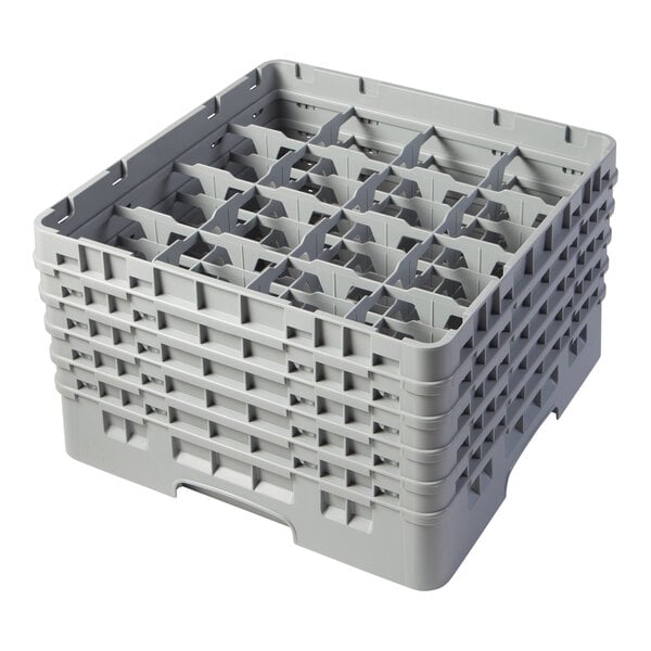 A gray plastic glass rack with 16 compartments and five extenders for holding and washing glassware.