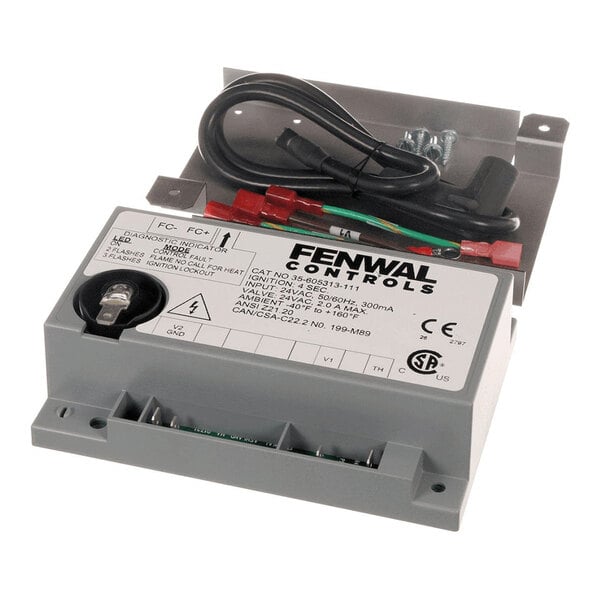 A gray electronic ignition module with attached wires and labeled terminals, featuring a Fenwal Controls label on top.