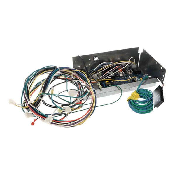A metal enclosure containing an electronic circuit board with multiple attached wires and connectors, including several coiled cables.