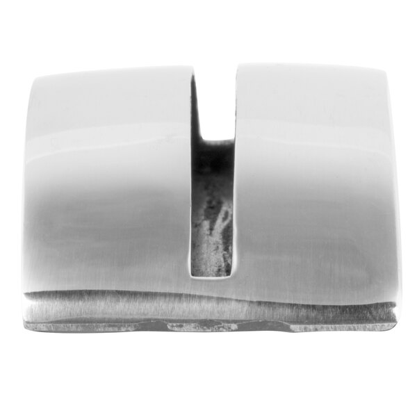 A small, shiny, metallic object with a curved top and a central vertical slot, likely used for holding cards or signs.