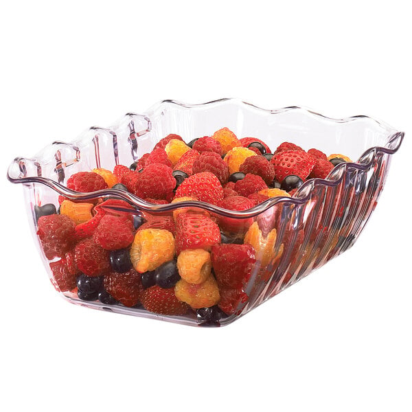 A clear, square-shaped plastic container filled with assorted berries including strawberries, raspberries, and blueberries.