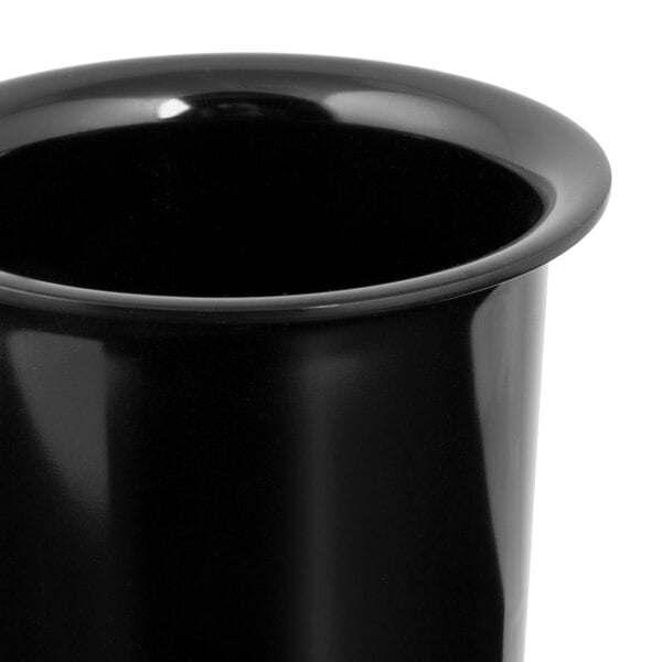 A close-up view of a glossy black cylindrical container with a flared rim.