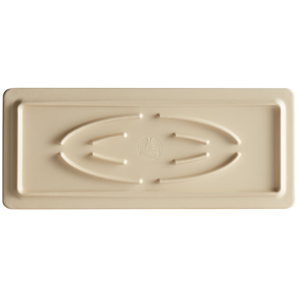 A rectangular, beige display board with a raised oval pattern and subtle embossed details on the surface.