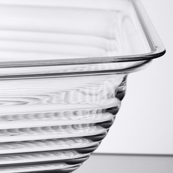 A close-up view of a clear, ribbed, rectangular glass or plastic bowl.