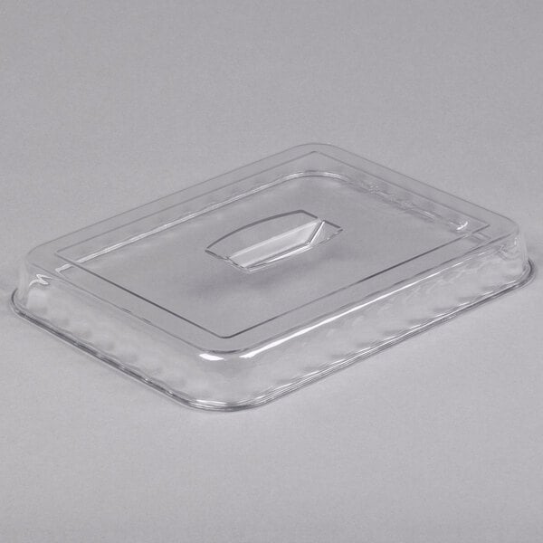 A clear, rectangular plastic lid with a raised handle in the center.