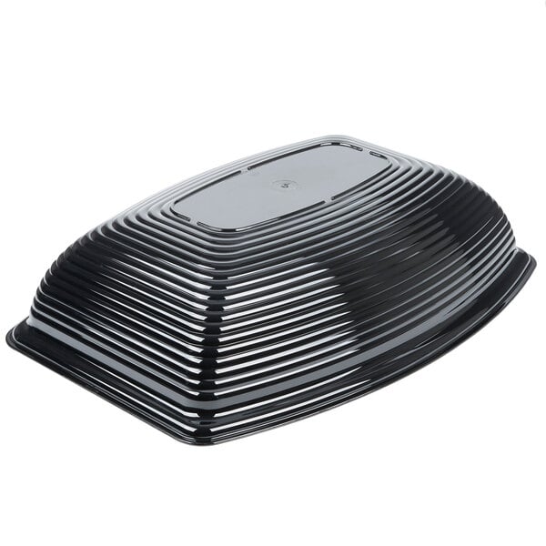 A black, rectangular, ribbed plastic bowl shown upside down on a white background.