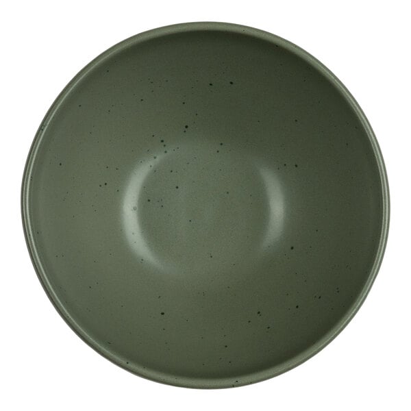 A round, green bowl with a smooth surface and small dark speckles, viewed from above.