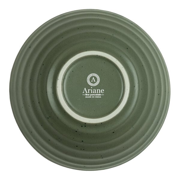 A round, green, ribbed porcelain bowl shown upside down with the brand name 'Ariane' and product details printed on the bottom.