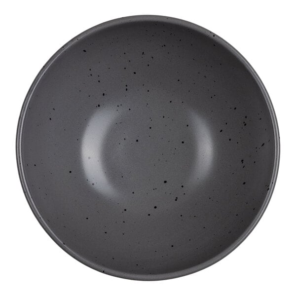 A round gray bowl with a smooth surface and small black speckles throughout.