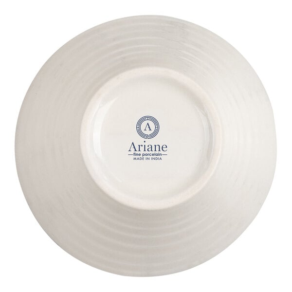 The image shows the underside of a round, white porcelain bowl with a logo and text that reads 'Ariane fine porcelain MADE IN INDIA' in blue.