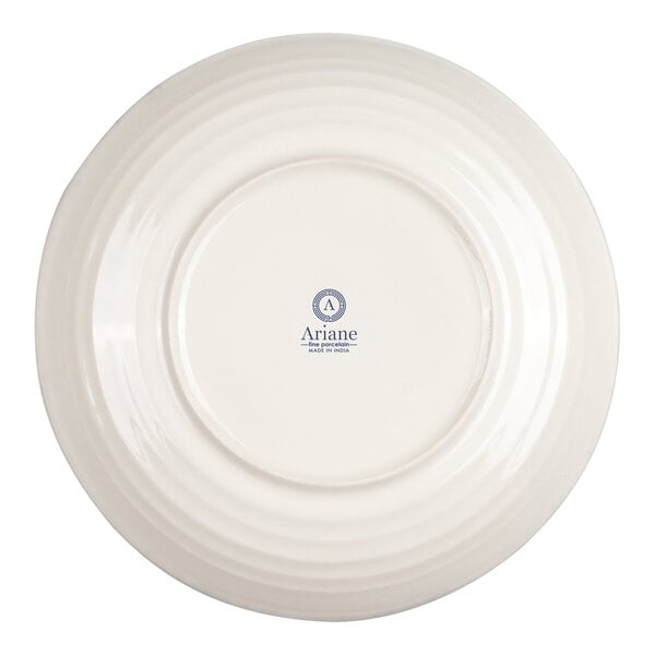 A round, ivory-colored porcelain bowl shown from the bottom, featuring a central logo and text.