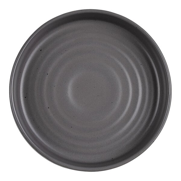A round, gray bowl with a smooth, slightly speckled surface and concentric circular ridges.