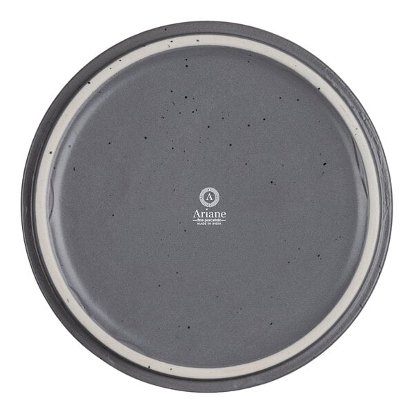 A round, gray plate with a subtle speckled pattern and a white ring near the rim, featuring the Ariane logo and text in the center.