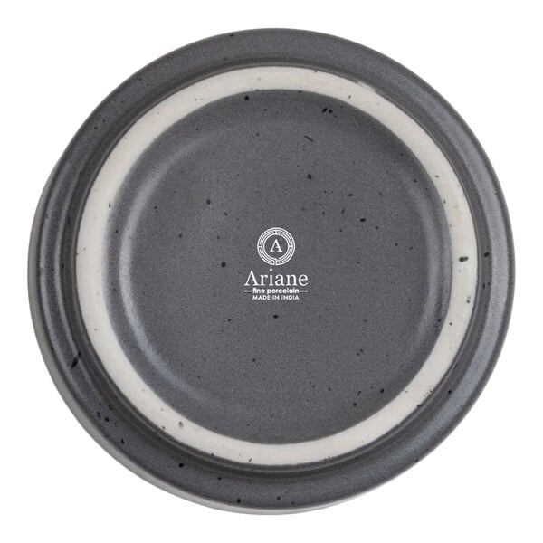 A round gray dish with a speckled pattern and a white ring near the rim, featuring the Ariane logo and text in the center.