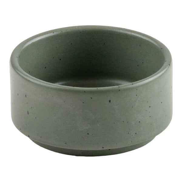 A small, round, green bowl with a smooth matte finish and subtle speckled pattern.