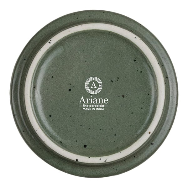 A round, green porcelain dish with a speckled pattern and a white inner ring, featuring the Ariane logo and text in the center.