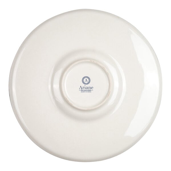 The image shows the underside of a round, white porcelain plate with a small circular base and a logo that reads 'Ariane' in the center.