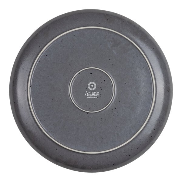 A round, gray plate with a speckled texture and two concentric white rings on the bottom, featuring the Ariane logo and text at the center.