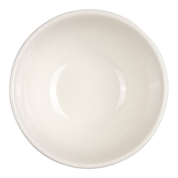 A round, plain, ivory-colored bowl viewed from above.
