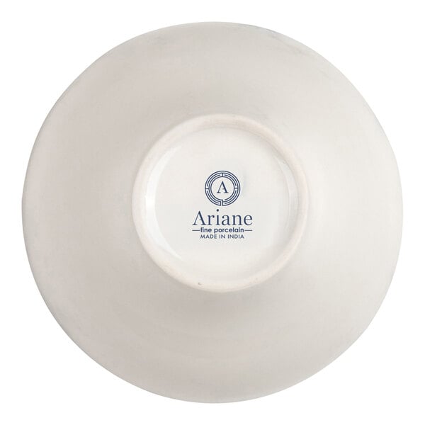 The image shows the underside of a white porcelain bowl with the brand name 'Ariane' and 'fine porcelain - MADE IN INDIA' printed in blue on the base.