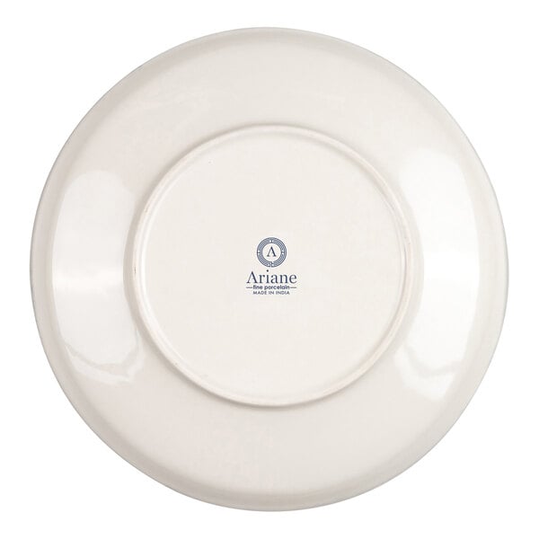 The image shows the underside of a round, ivory-colored porcelain bowl with a logo and text printed in the center.