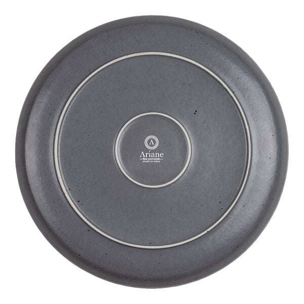 A round gray plate with a smooth finish, concentric circular ridges, and a central logo that reads 'Ariane'.