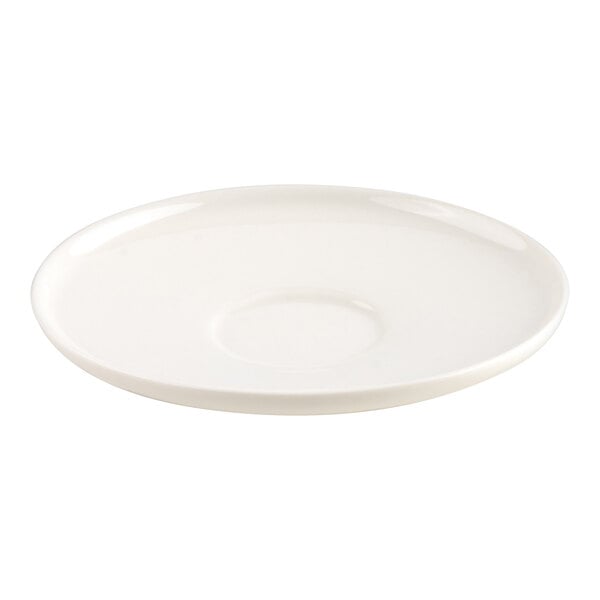 A plain, round, white saucer with a slight indentation in the center.