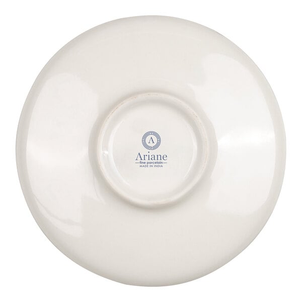 The image shows the underside of a round, white porcelain saucer with a logo and text printed in the center.