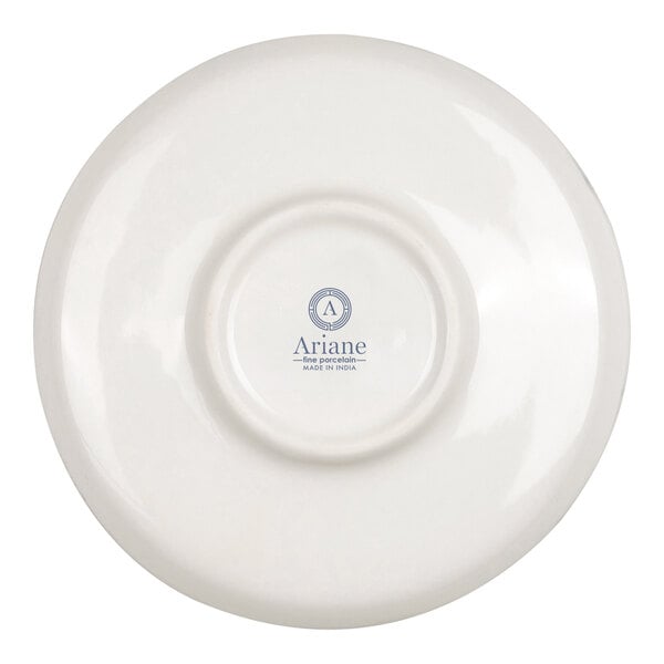 The image shows the underside of a round, white porcelain saucer with a logo and text printed in the center.