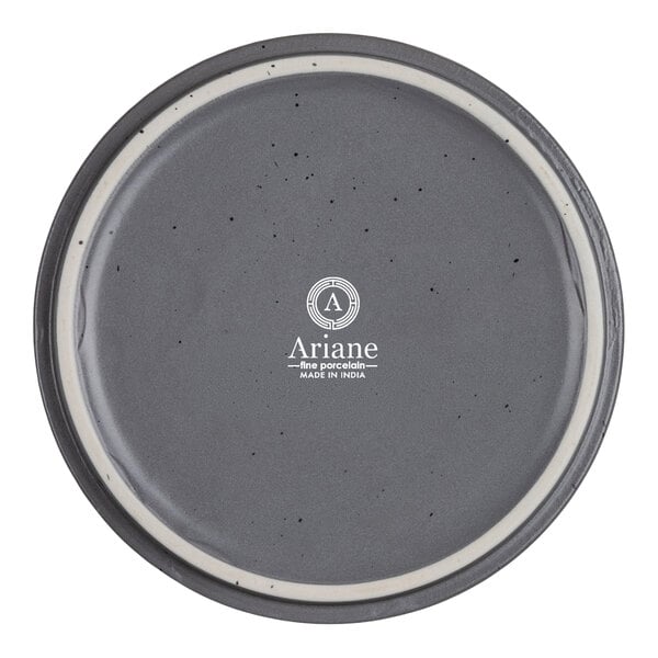 A round, gray porcelain bowl with a speckled pattern and a white inner rim, viewed from above.