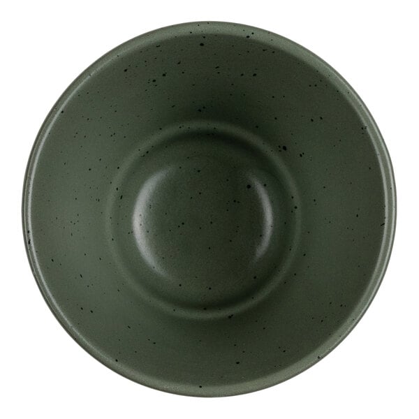 A round, green bowl with a speckled pattern viewed from above.