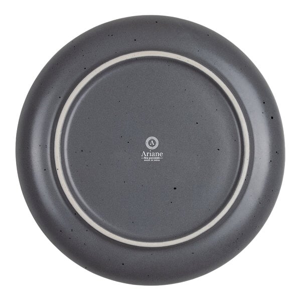 A round, gray plate with a slightly speckled finish and a visible brand logo on the bottom center.