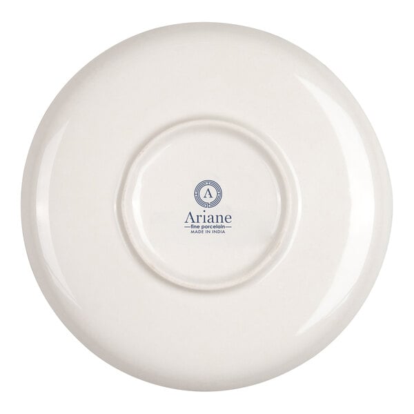 The image shows the underside of a round, ivory-colored porcelain plate with a logo and text at the center.