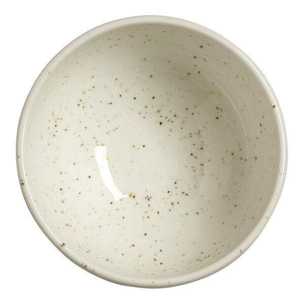 A round, white bowl with a speckled pattern viewed from above.