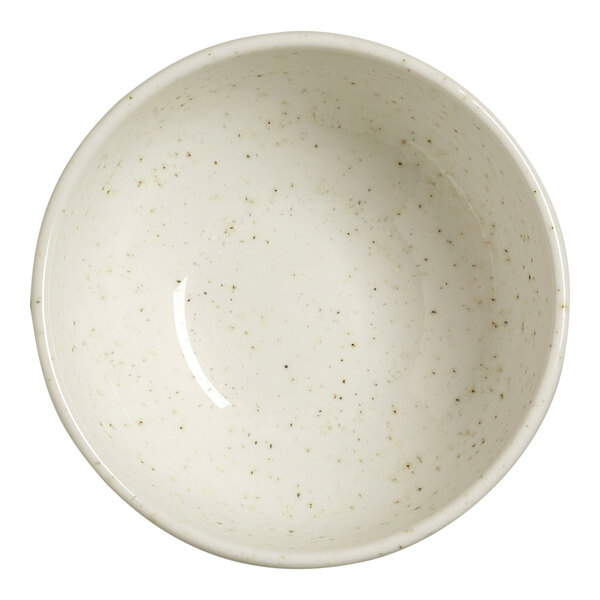 A round, white bowl with subtle speckled patterns on its inner surface.