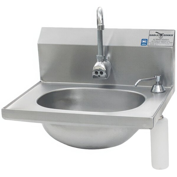 A stainless steel Eagle Group hand sink with a faucet and soap dispenser.