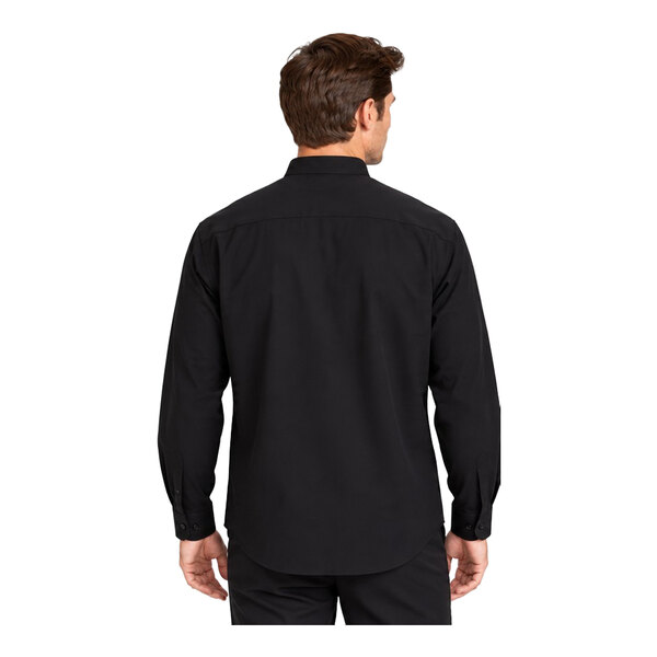 A man is shown from the back wearing a long-sleeve black dress shirt and black pants.