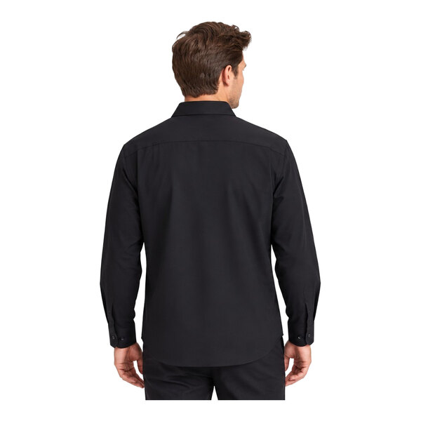 A man is shown from the back wearing a long-sleeve black dress shirt and black pants.