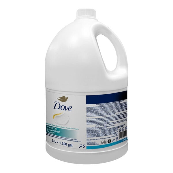 A large white plastic jug with a handle and a label indicating it contains Dove shampoo, with a capacity of 5 liters (1.320 gallons).
